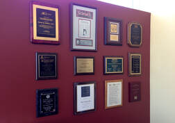Award plaques in office