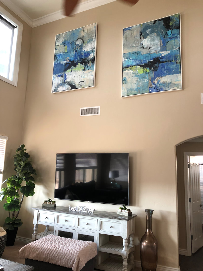 Large scale art hanging on 20' wall